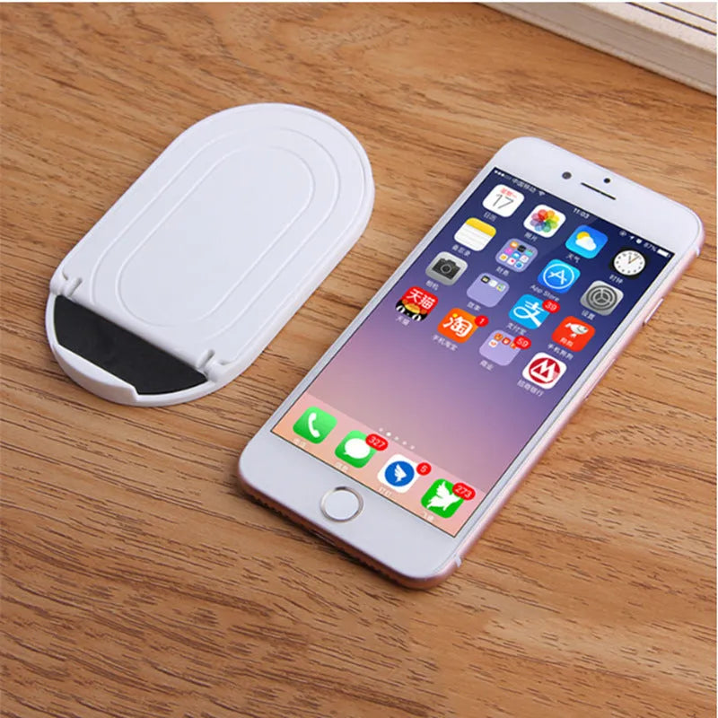 Plastic mobile phone stand in six colours showing 360-degree rotation feature