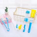 Orange Belle seven-piece bottle brush set in blue and pink includes sponge brush, nylon brush, nipple brushes, straw brushes, and bottle holder