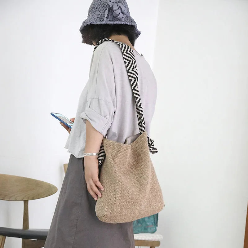 Khaki one-shoulder polyester canvas tote bag with cotton lining, magnetic closure, and internal pockets on a plain background