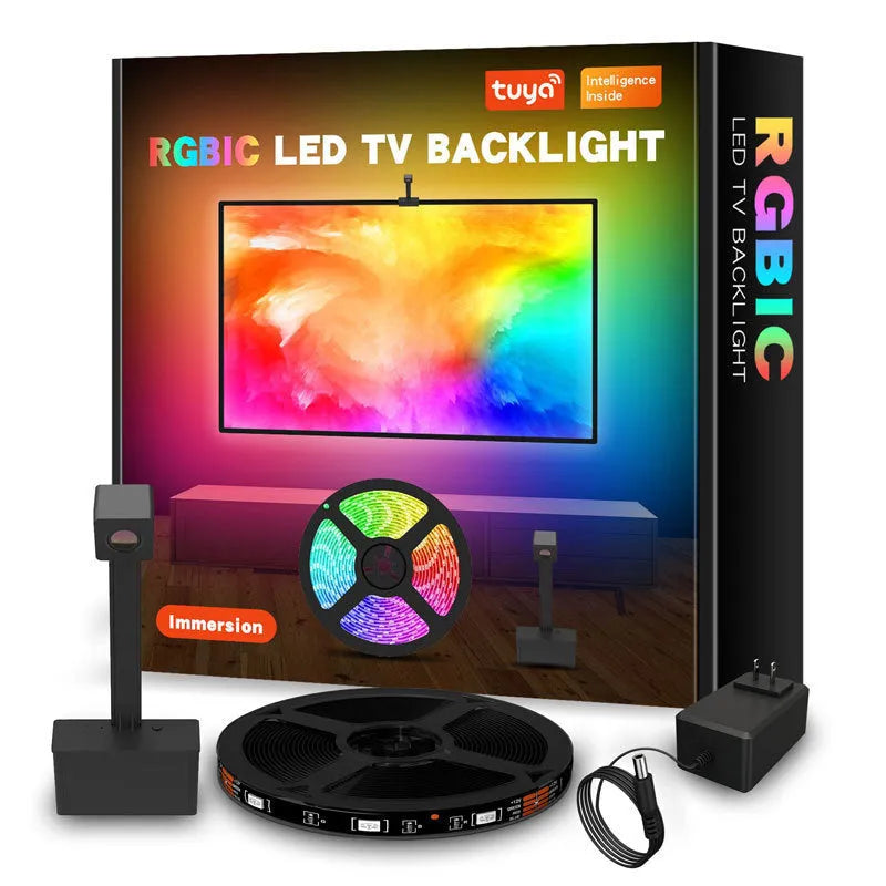 Black smart LED light strip with camera controller for TV backlighting, shown with remote and smartphone app interface.