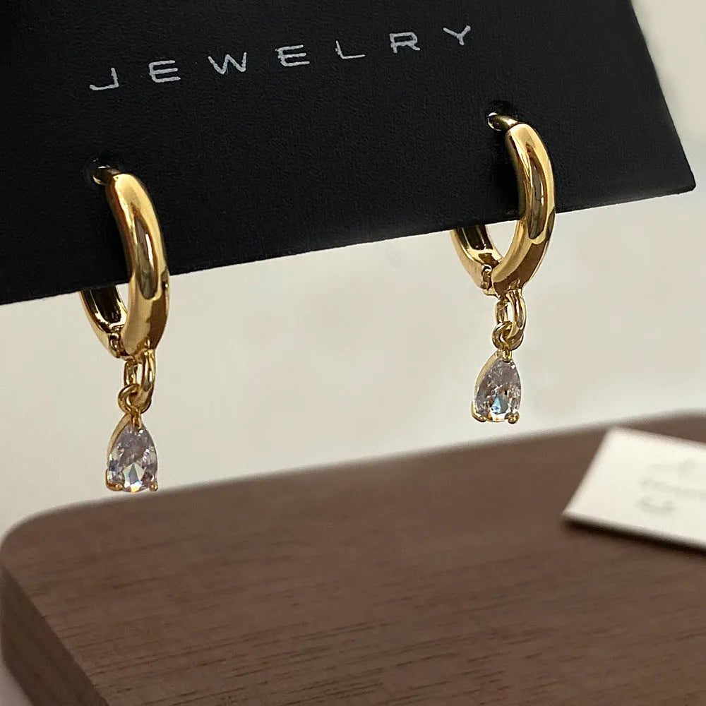 Women's zircon jewellery set with necklace, earrings, and anklet featuring geometric meteor shower design