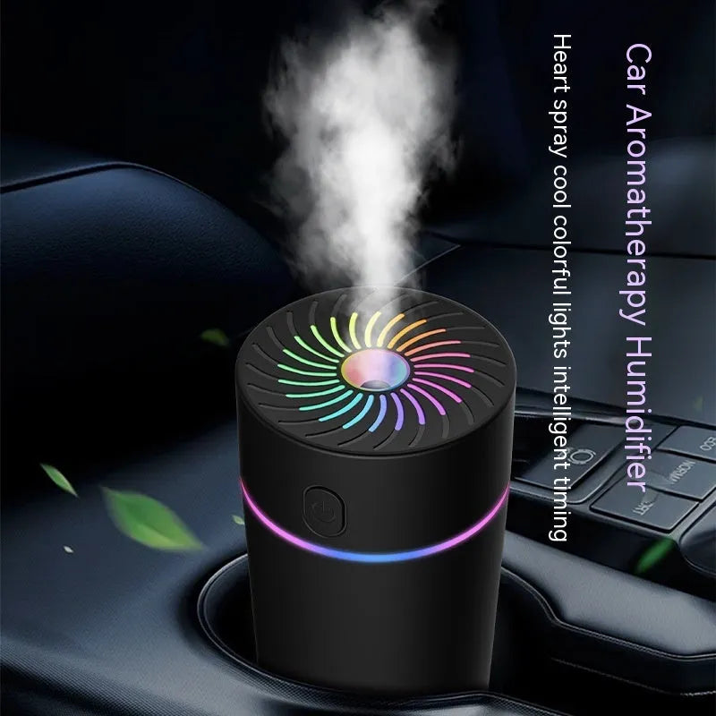 Compact white car humidifier with USB cable connection and essential oil aromatherapy function