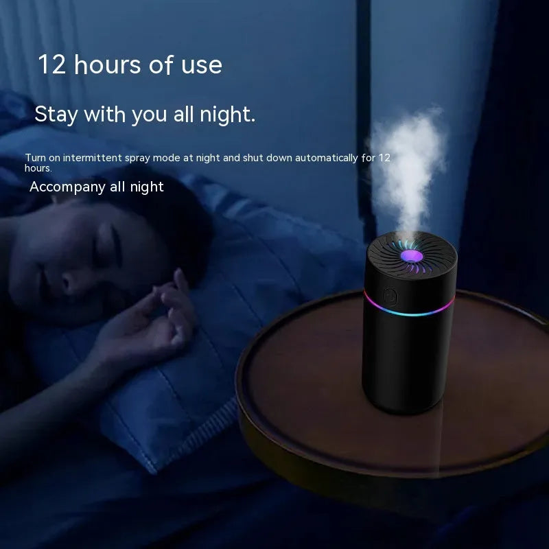 Compact white car humidifier with USB cable connection and essential oil aromatherapy function