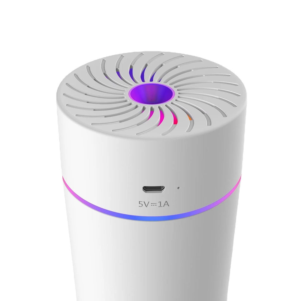 Compact white car humidifier with USB cable connection and essential oil aromatherapy function
