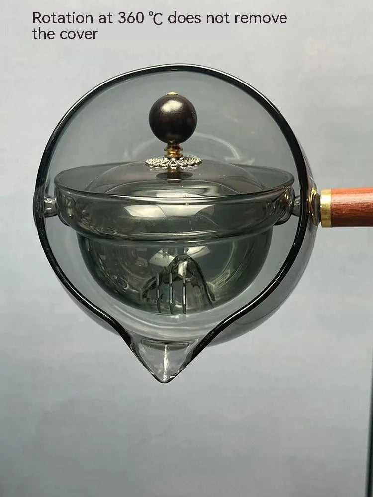 Transparent borosilicate glass teapot with wooden handle and rotation mechanism