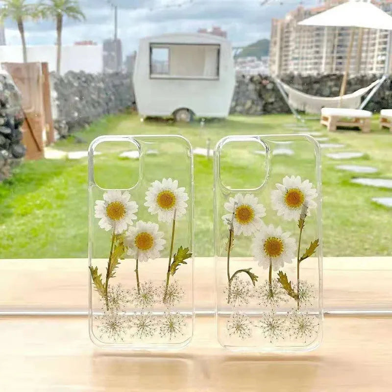 White TPU iPhone case with a raised epoxy daisy flower design on the back