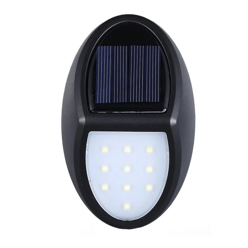 Black solar-powered LED wall light with automatic sensor for outdoor garden or patio illumination