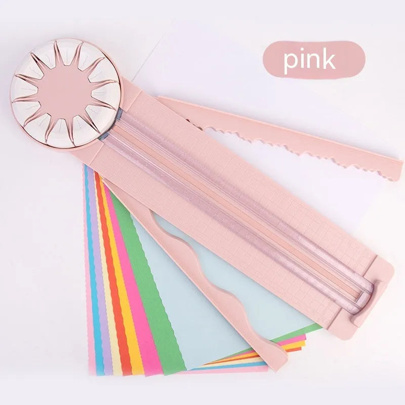 Plastic 12-in-1 paper cutting machine in pink or black colours with dotted cutting mechanism