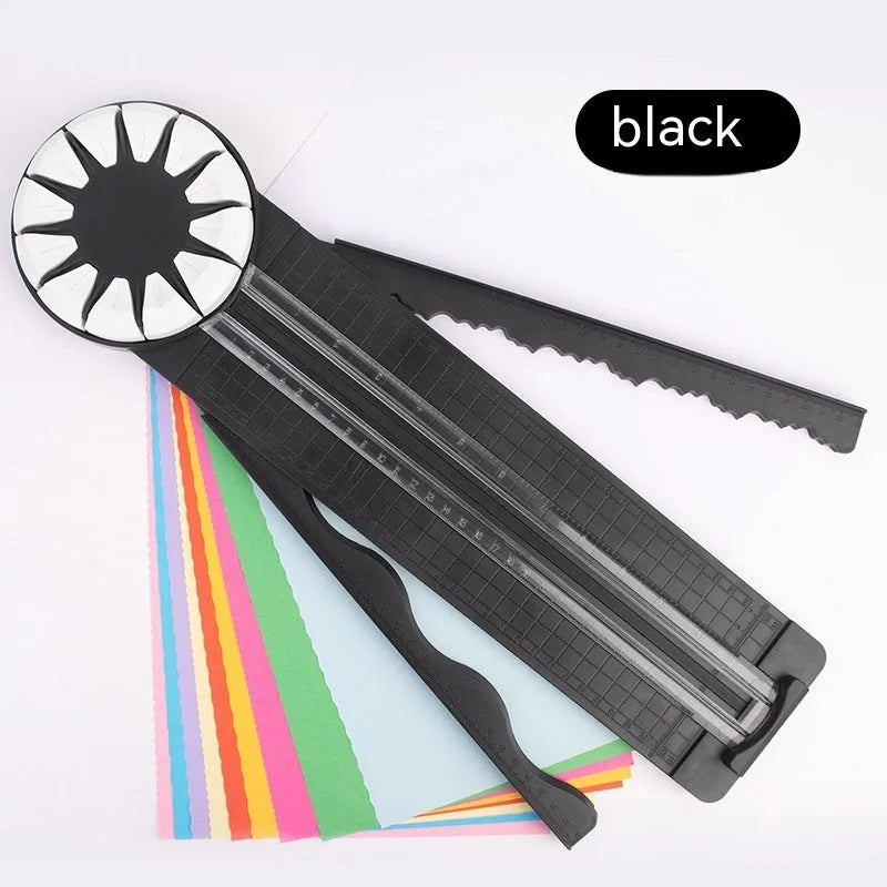 Plastic 12-in-1 paper cutting machine in pink or black colours with dotted cutting mechanism