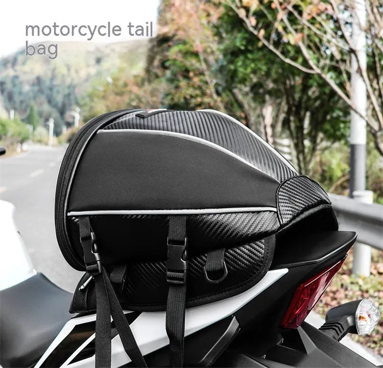 Black waterproof motorcycle seat bag with reflective strips, measuring 30x28x21cm with convertible crossbody strap