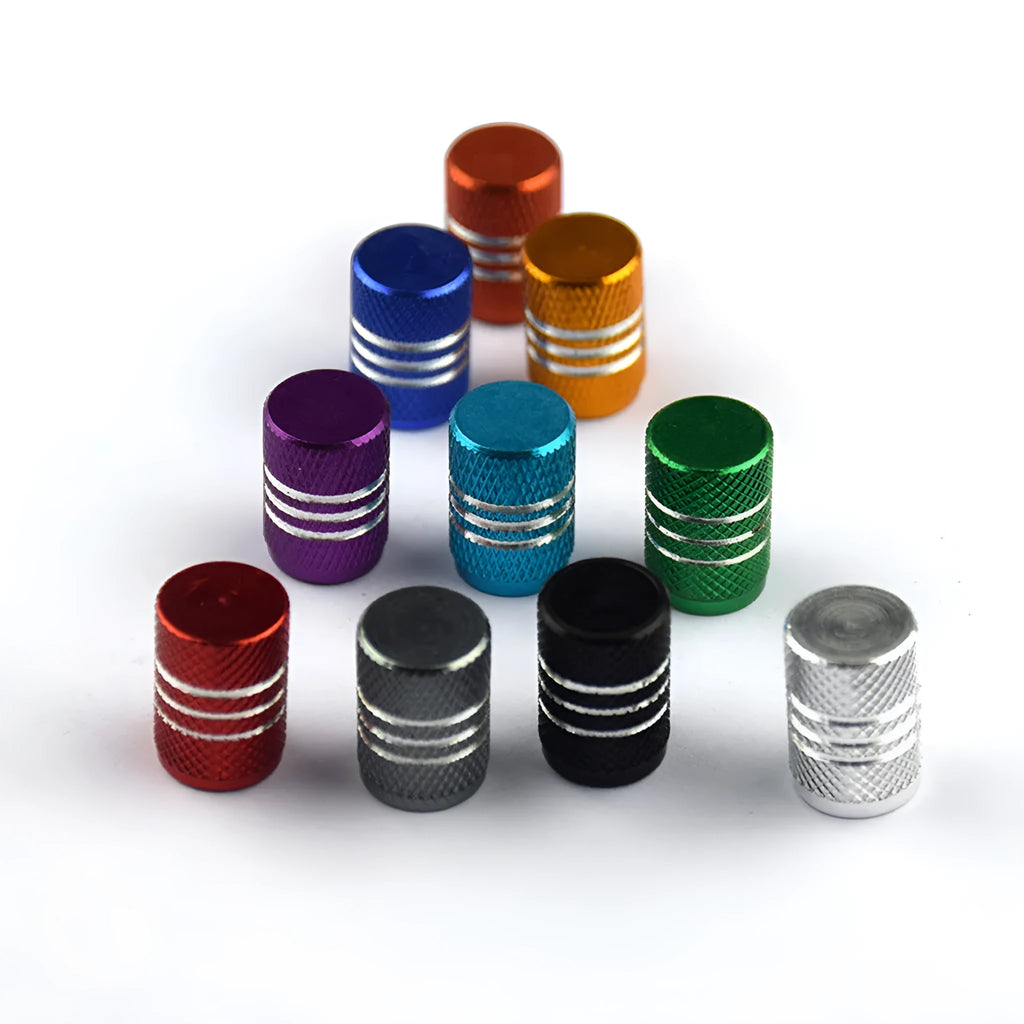 Set of coloured aluminium alloy car tyre valve caps showing stainless steel threads, displayed on a grey background.