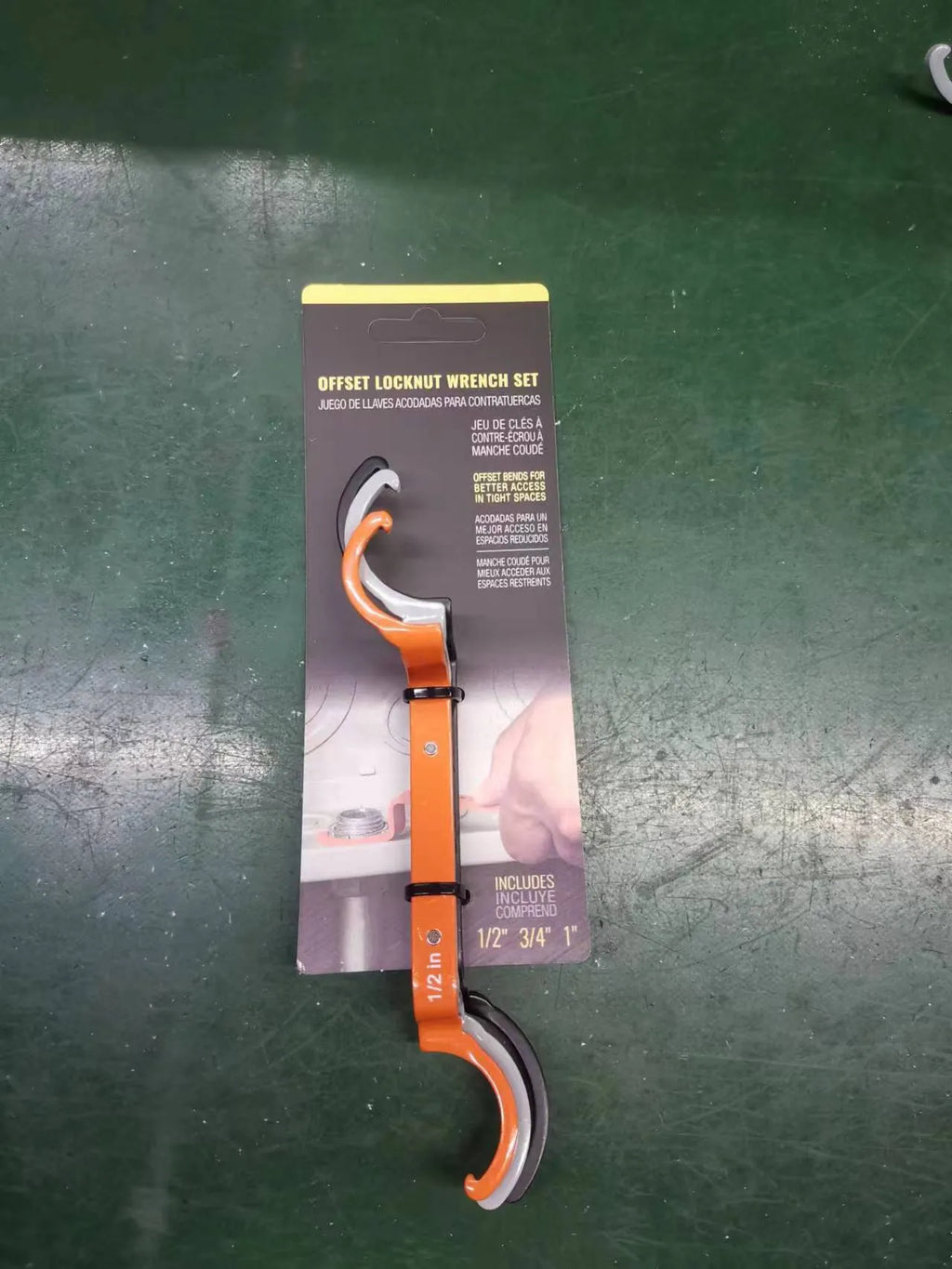 Three magnetic catheter locking wrenches in orange, grey, and black colours displayed together.
