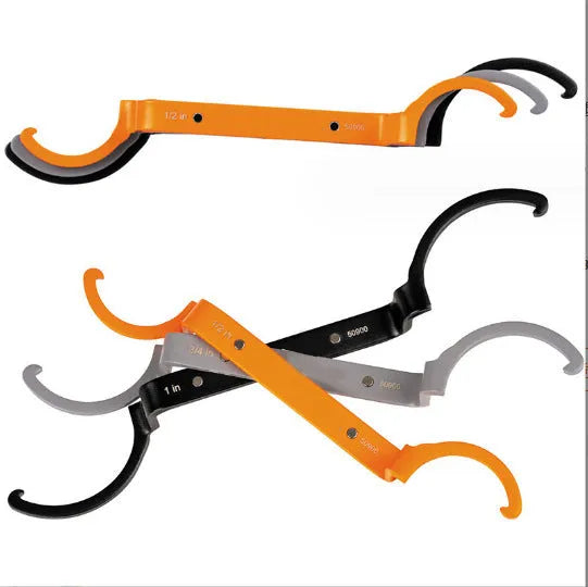 Three magnetic catheter locking wrenches in orange, grey, and black colours displayed together.