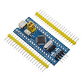 STM32F103C8T6 ARM microcontroller development board with Mini USB connector and pin headers.