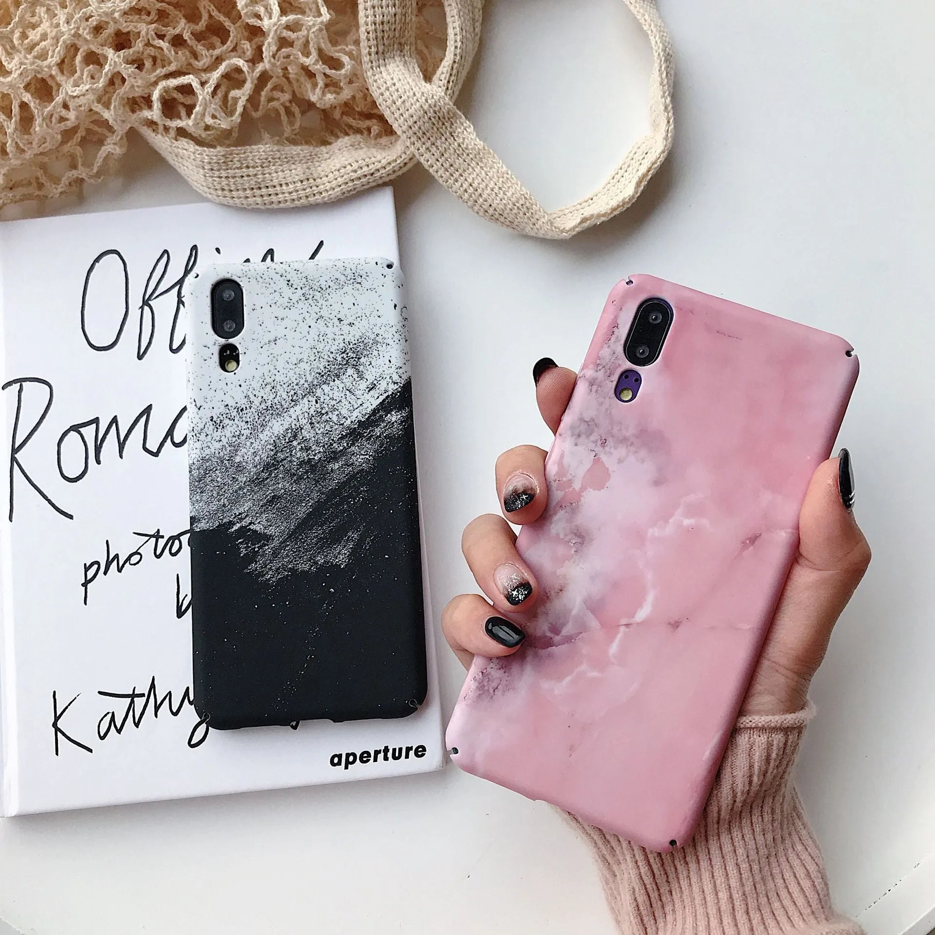 Black painted polycarbonate back cover case for a Huawei smartphone on a white background.