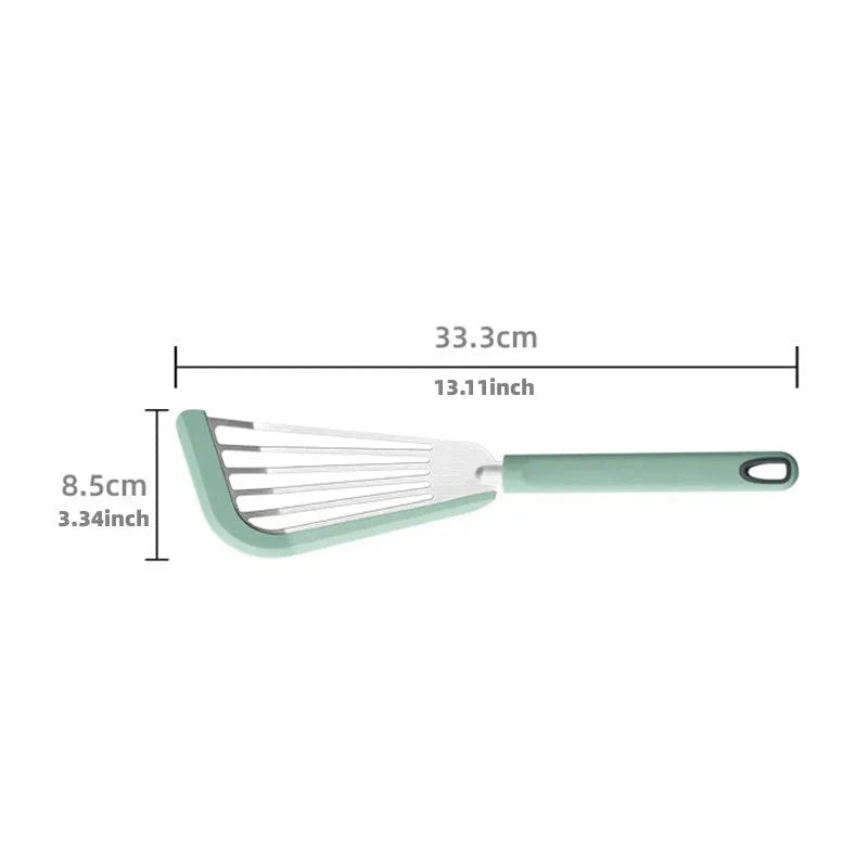 Green silicone fish spatula with 1mm thin slotter blade and hanging hole on a kitchen counter