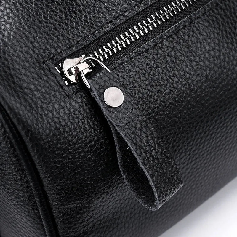 Black genuine leather crossbody shoulder bag showing front view and dimensions