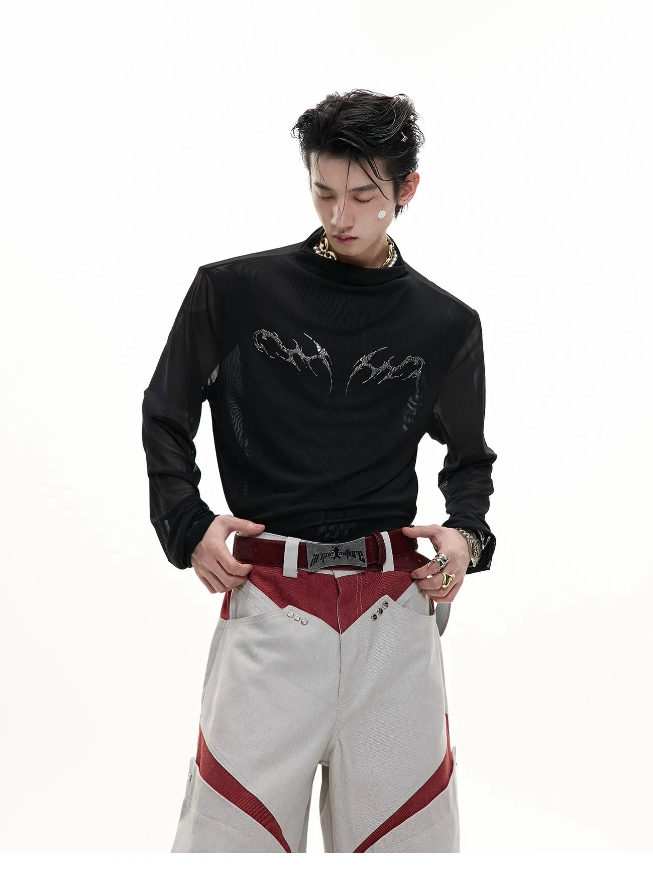 Man wearing a black slim fit long sleeve ice-feel top made from polyester and spandex blend.