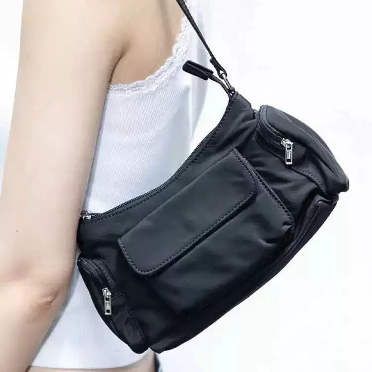 Black PU women's shoulder bag with double pockets and side line detail.