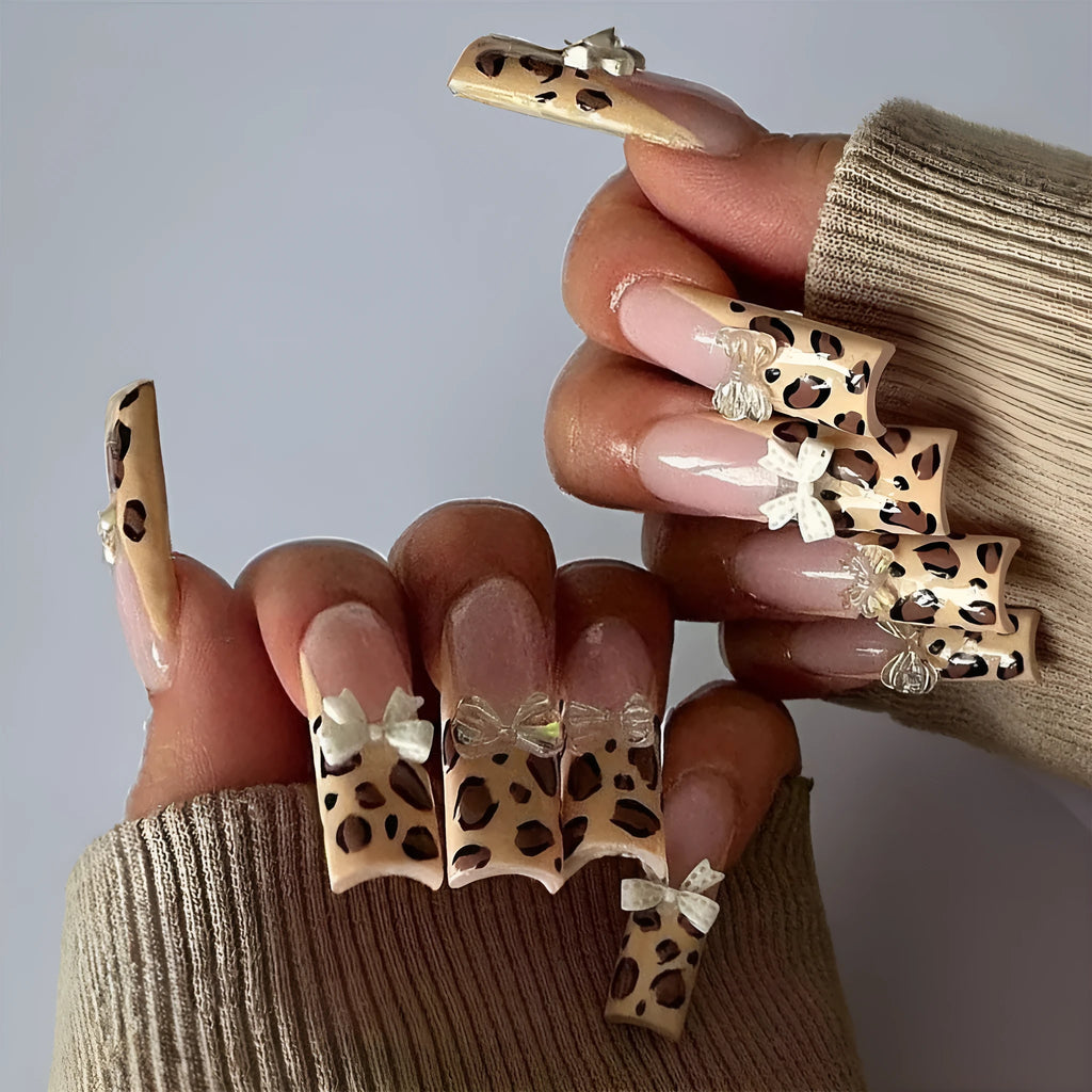 Leopard print butterfly nail art kit with plastic decorative tips in colour WM296