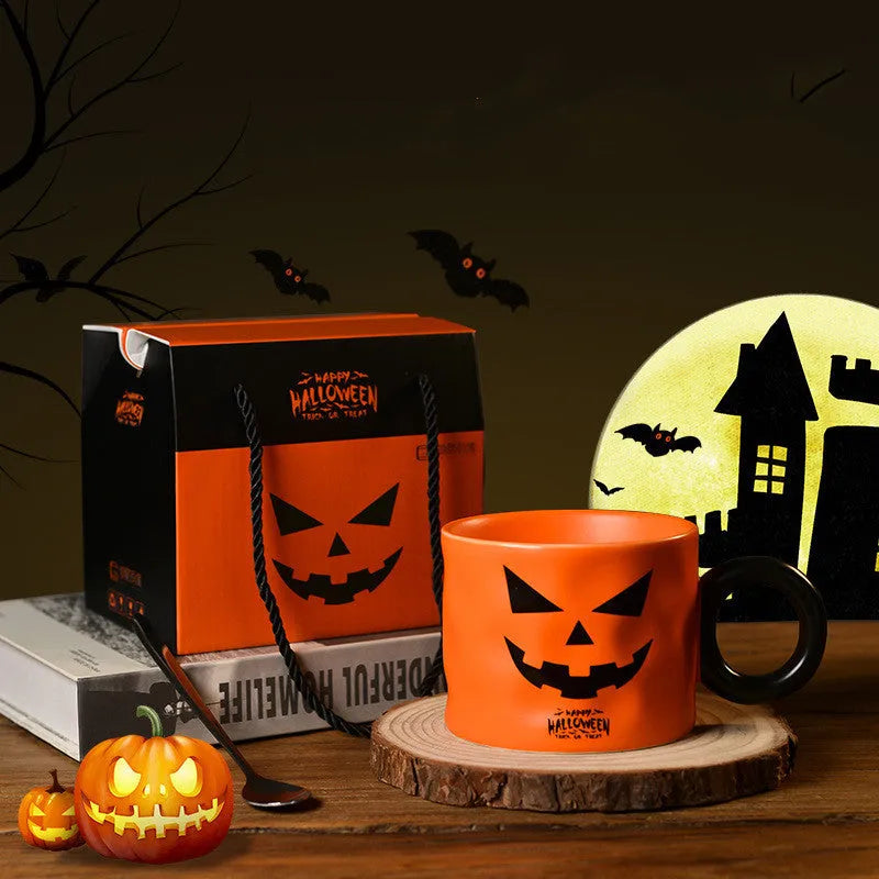 Orange ceramic Halloween pumpkin mug with handle and dessert spoon in gift box packaging