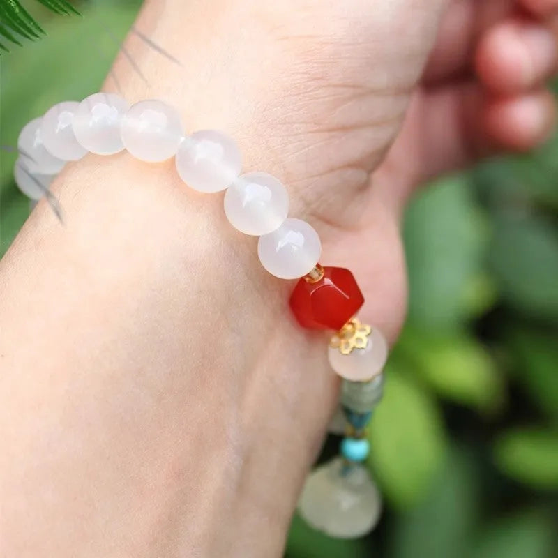 Hand-woven Chinese style agate bracelet with lotus seedpod beads and geometric design
