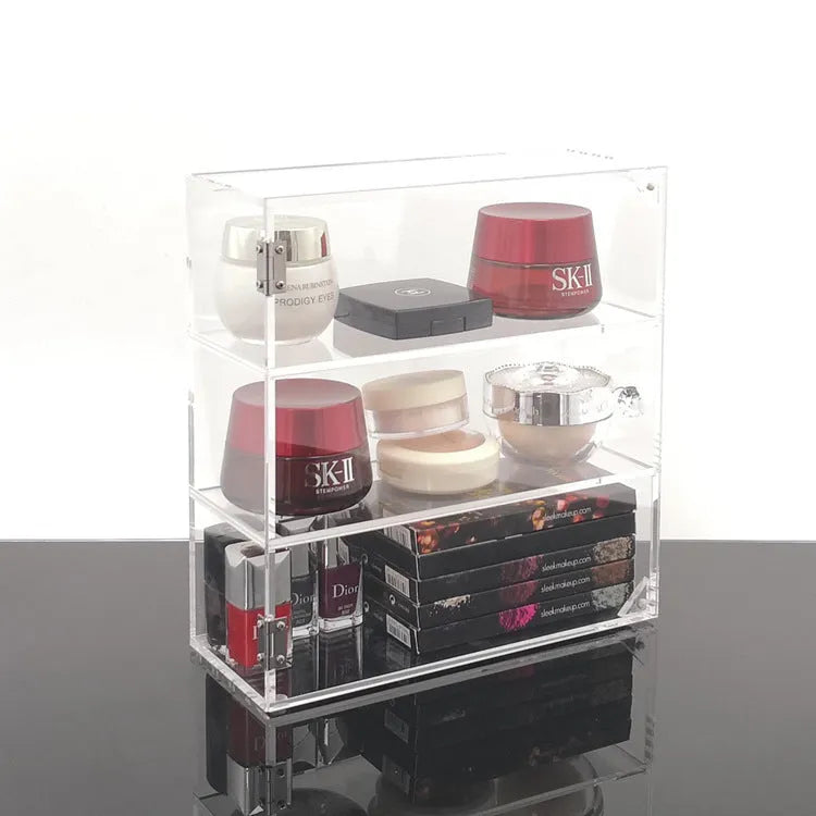 Clear acrylic cosmetics storage box 24x10x34cm on a vanity table holding makeup and skincare products