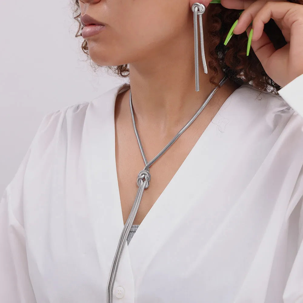 Gold electroplated titanium steel necklace with tassel pendant and matching earrings set