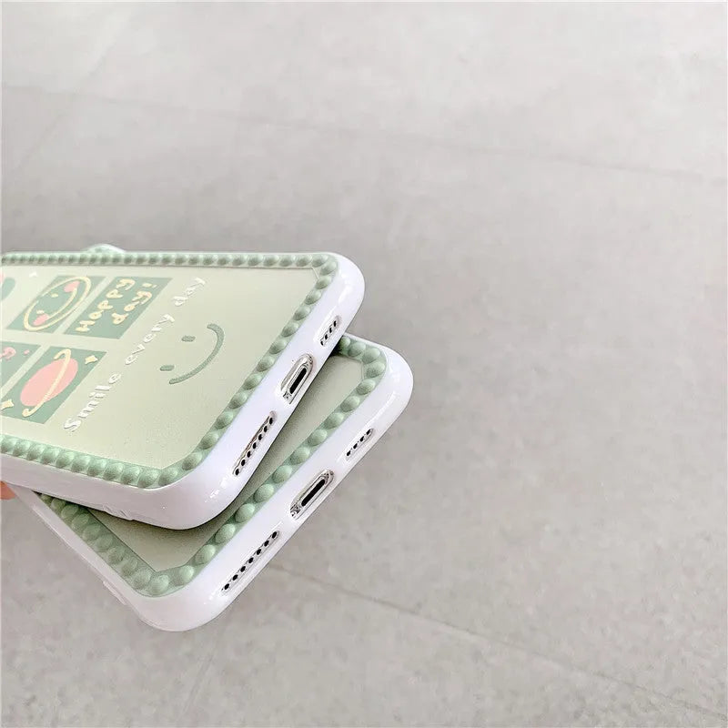 Green iPhone case with smiley face and polka dot geometric design on a soft rubber TPU back cover.