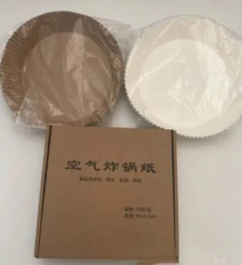 Round white disposable parchment paper liner for air fryer basket with raised edges.