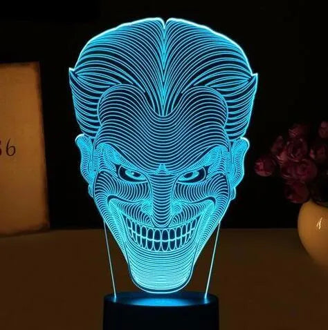 USB-powered 3D acrylic LED lamp displaying multiple colours, shown with its remote control and stand.