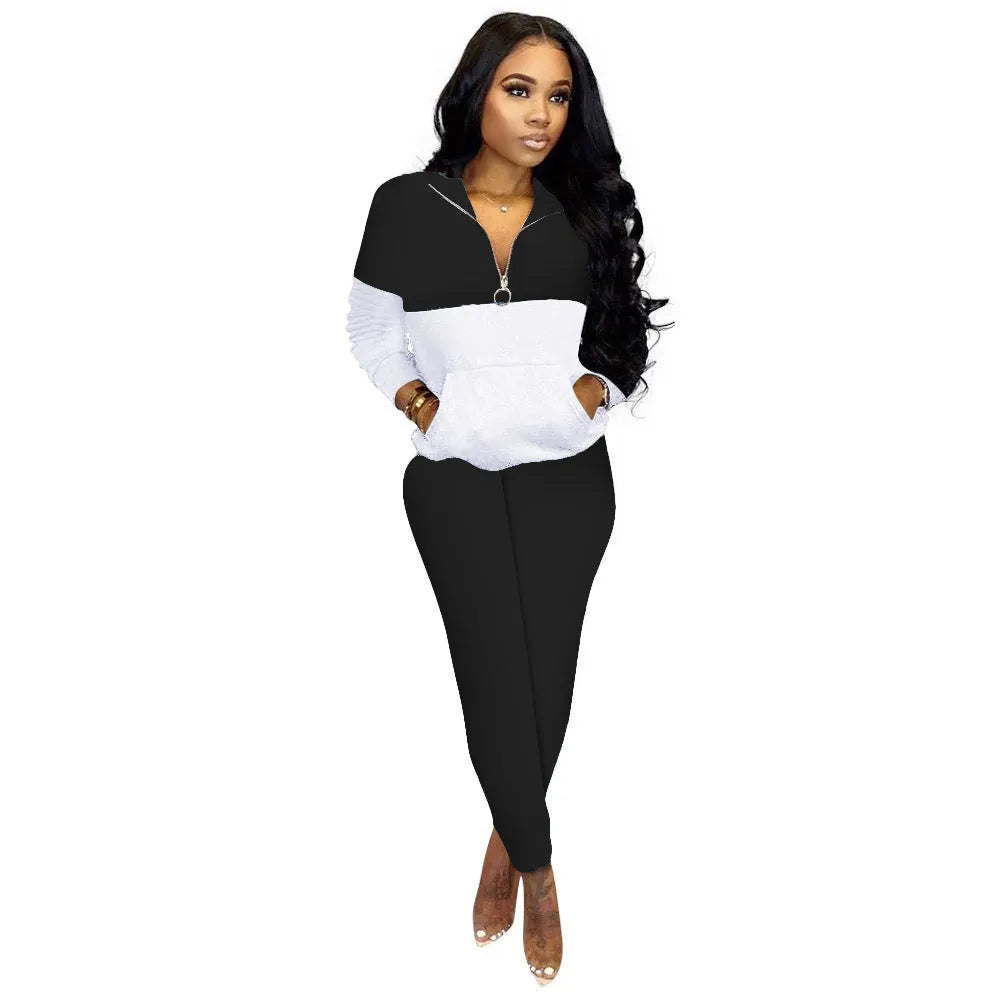 Women's casual solid colour stitching two-piece set in black showing quarter-sleeve top and matching trousers