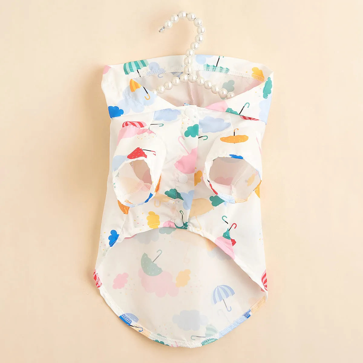 Colourful cartoon umbrella pattern polyester raincoat for a dog, sizes XS to XL.