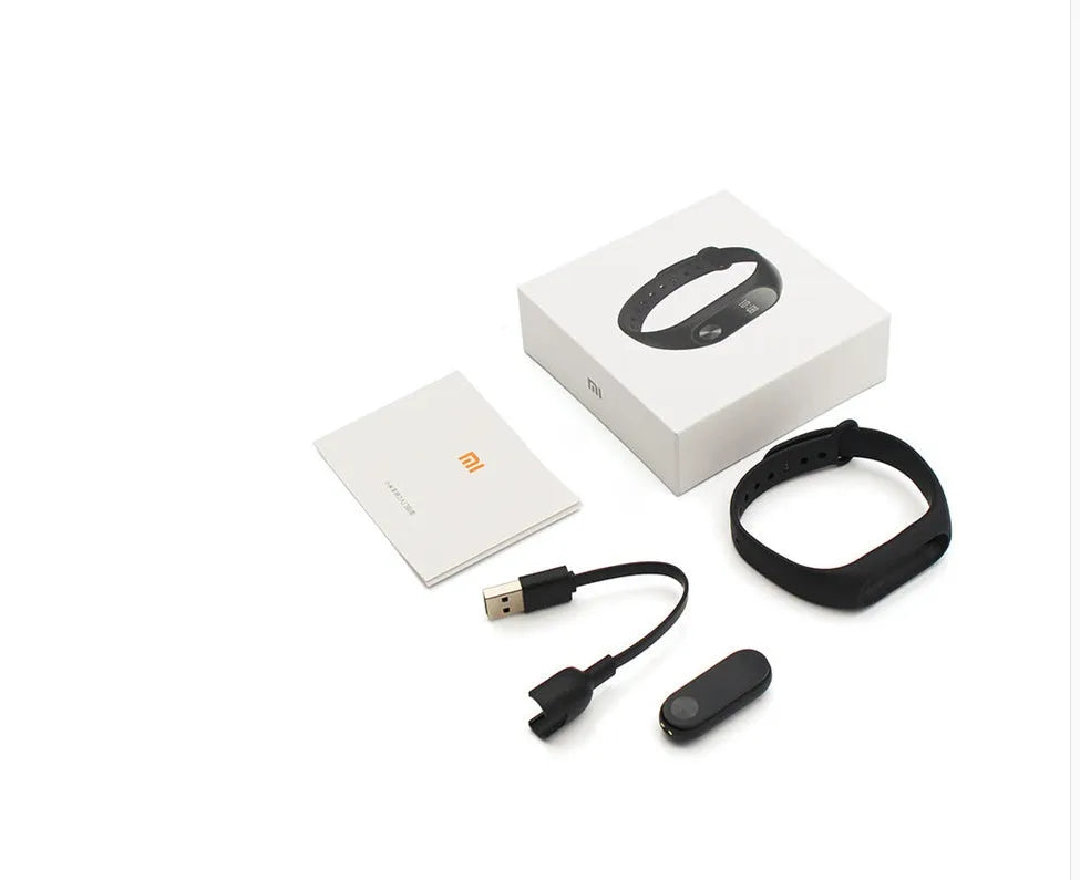 Black Xiaomi Mi Band 2 smart fitness bracelet with OLED display on adjustable wrist strap