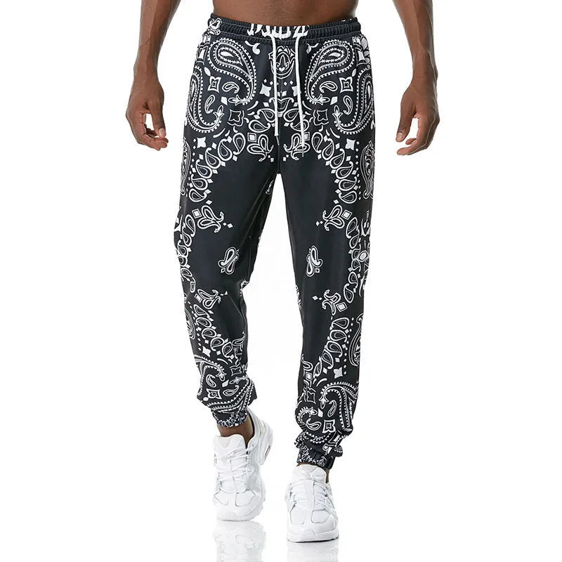 Printed jogging pants for young people, loose fit, polyester blend, mid waist with belt, digital print, ribbed hem