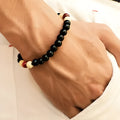 Natural stone beaded bracelet with lava stones for essential oils, ethnic unisex design.