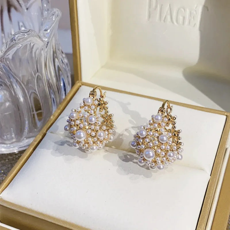 Women's gold flower basket earrings with small rice beads and pearl inlay on copper