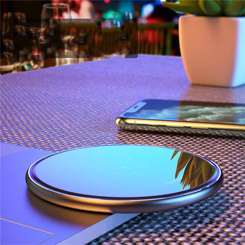 Black wireless charging pad with LED indicator light on aluminium alloy surface