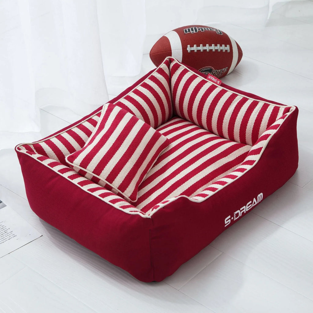 Navy stripes dog crate mat and matching fabric pillow set on a white background.