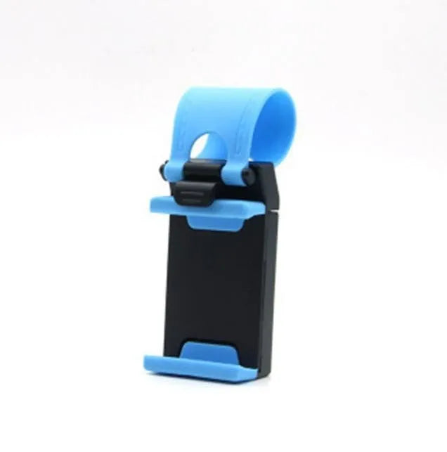 Black universal steering wheel phone holder clip mounted on a car steering wheel holding a smartphone.