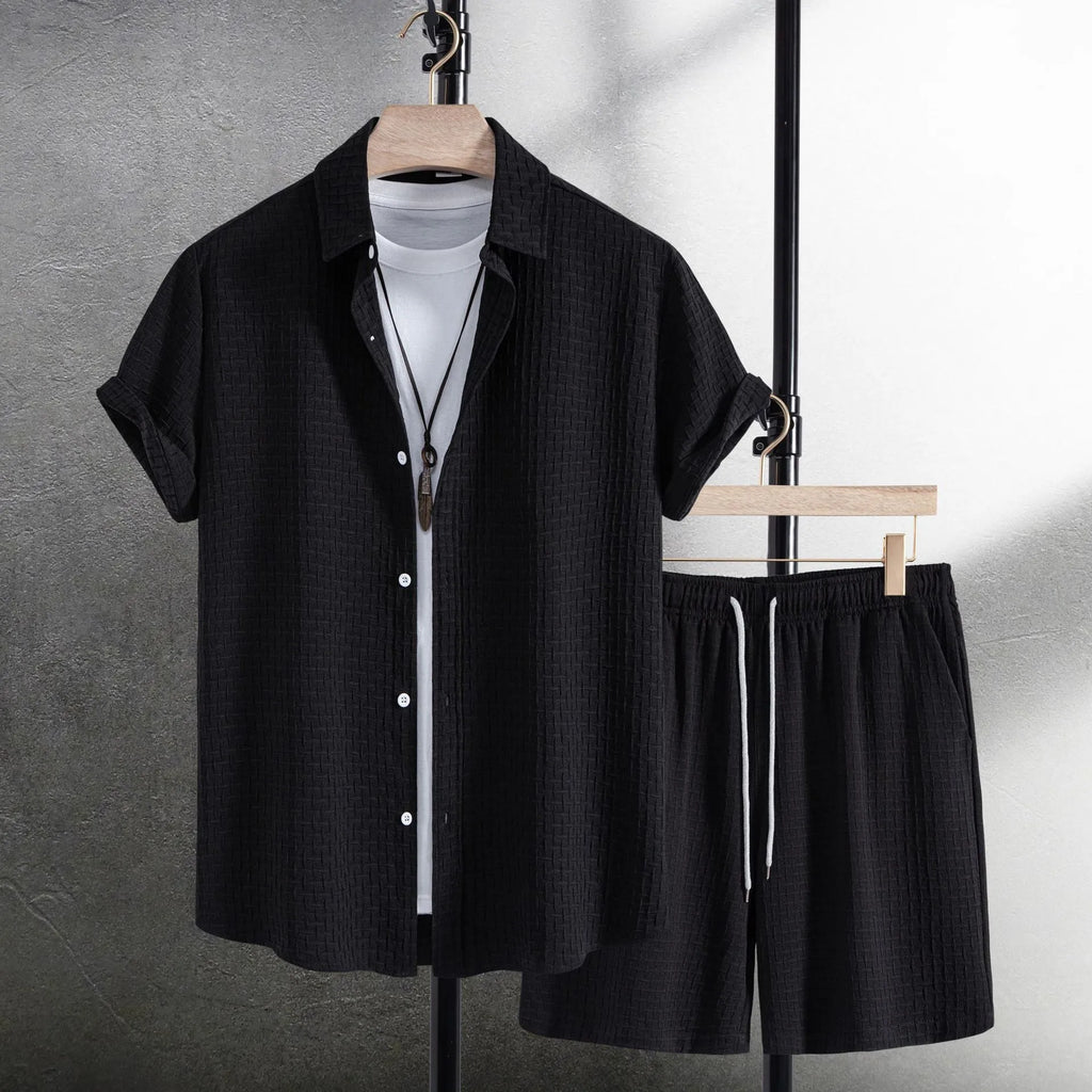 Men's casual short sleeve shirt and matching shorts set in black, laid flat.
