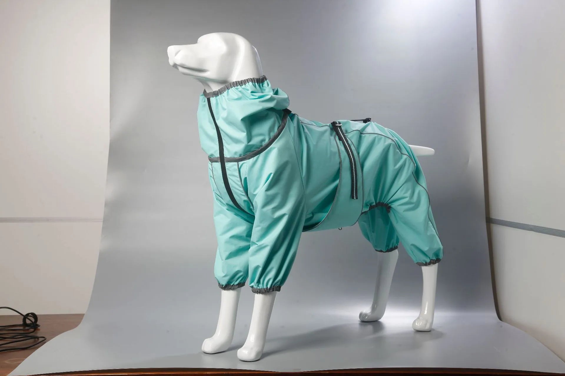 Dog wearing red polyester shell jacket with cotton-padded interior for warmth