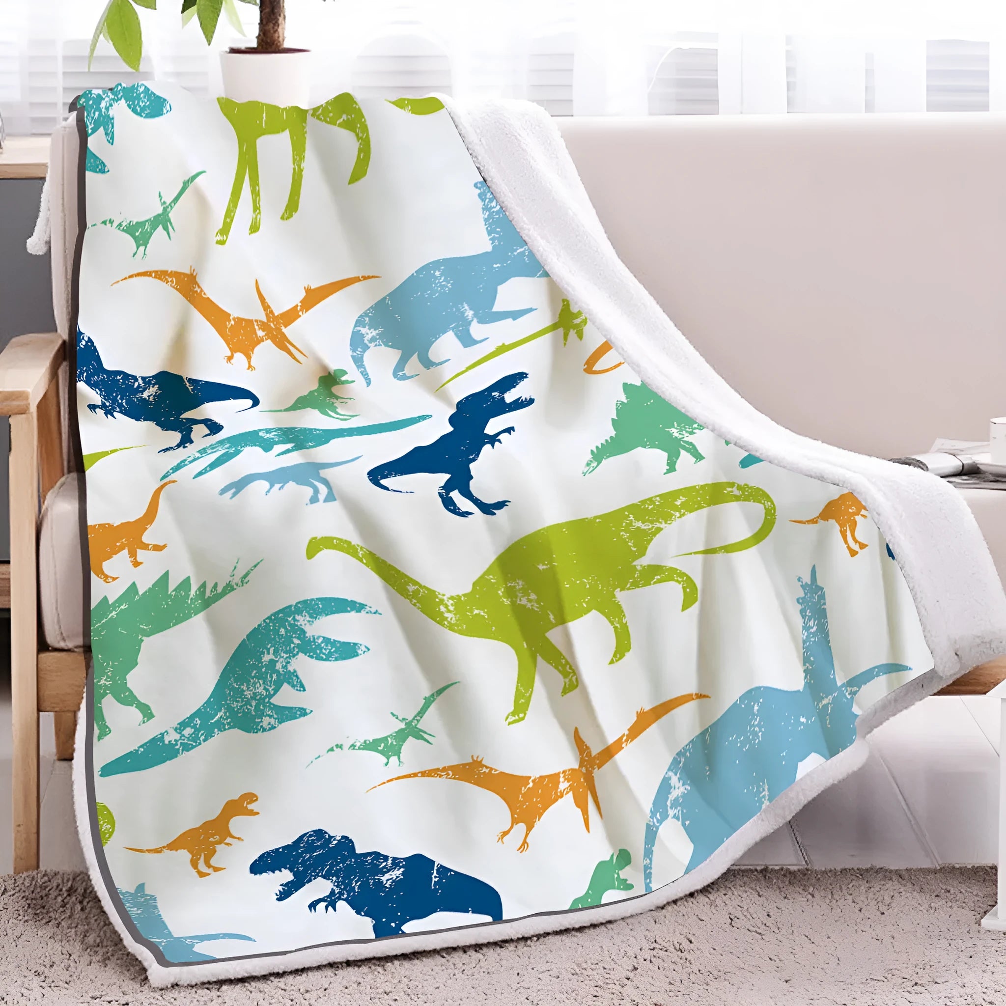 Dinosaur themed lamb wool blanket in white on a sofa, measuring 130x150cm or 150x200cm