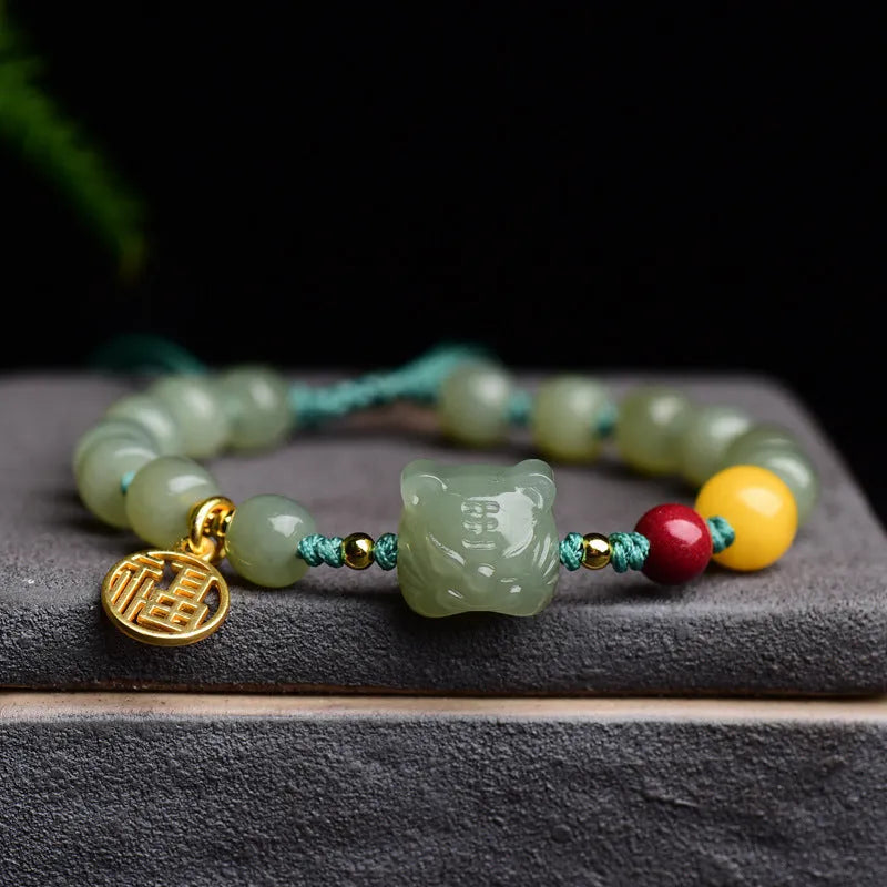 Natural Hetian Jade bracelet with cinnabar and beeswax beads, animal zodiac motifs, and sequin details on a string