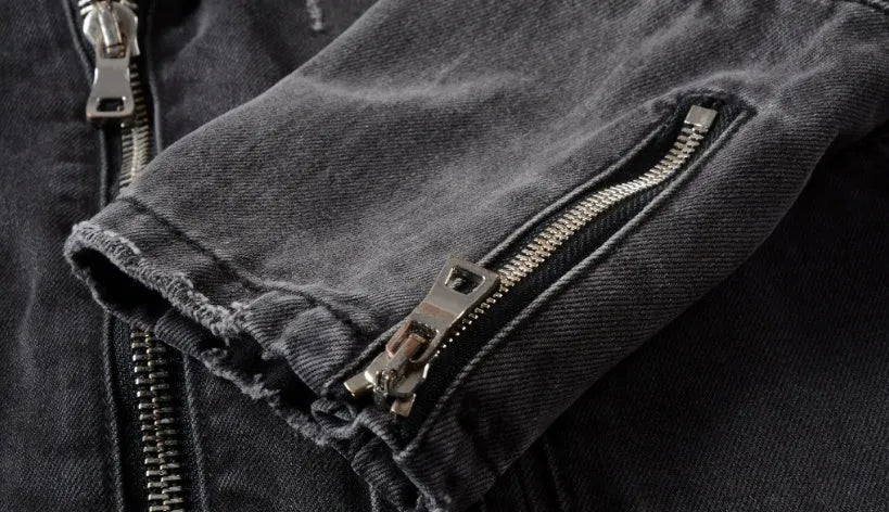 Black slim fit linen denim jacket with zipper front, zipper pockets, and lapel collar on a person