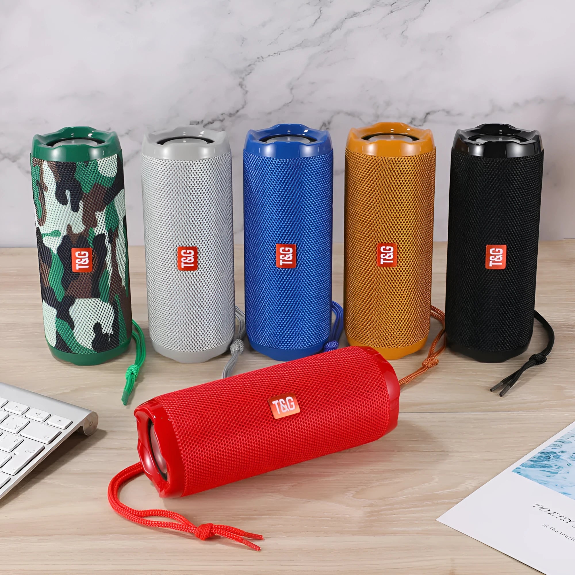 Portable fabric-cased Bluetooth speaker with card holder in multiple colour options.