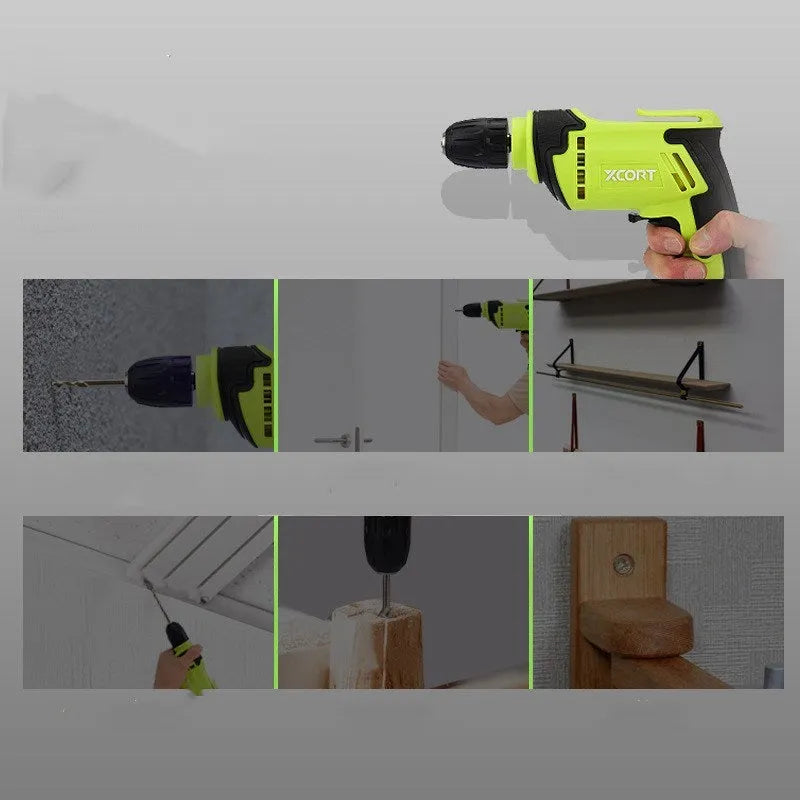 Pistol-grip electric power drill with a black and orange casing on a workbench.