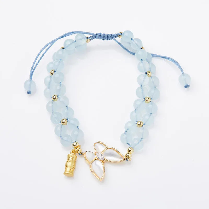 Women's aquamarine butterfly woven bracelet with retro styling and 6mm width