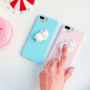 Close-up of a soft silicone iPhone case with a 3D cartoon cat design.