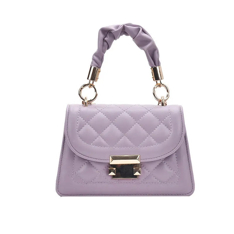 Purple rhombus-shaped women's shoulder bag with a chain strap on a white background.